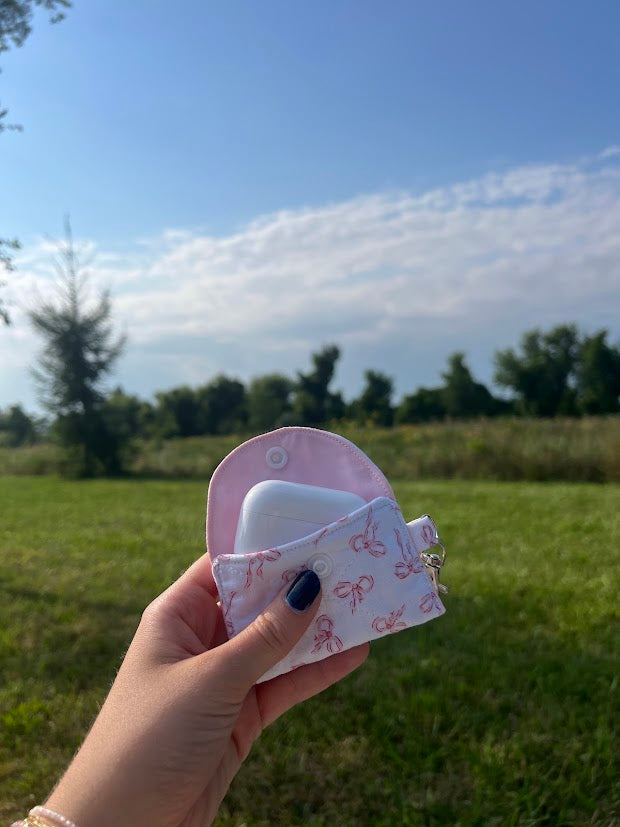 Scattered pink bow AirPod case