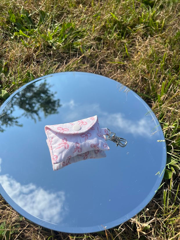 Scattered pink bow AirPod case